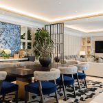 malakiya villas hotel living and dining area with softly lit coffered ceiling and back lit shelving