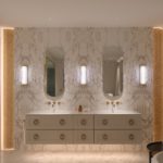 layered bathroom lighting with wall lights, strip light at side and under vanity unit