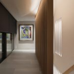 hall and stairs with contemporary architecture and up and downlit slots for this passive house