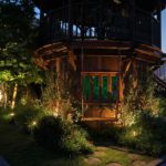 The curves of the tree house are uplit with Hampton Floodlights emphasising its curve