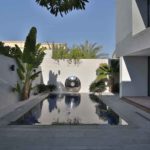 before the lighting design was redesigned in this courtyard swimming pool