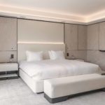 cool calm bedroom with lighting concealed in a ceiling coffer