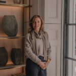 Sally Storey, lighting designer in her London home with backlit shelving